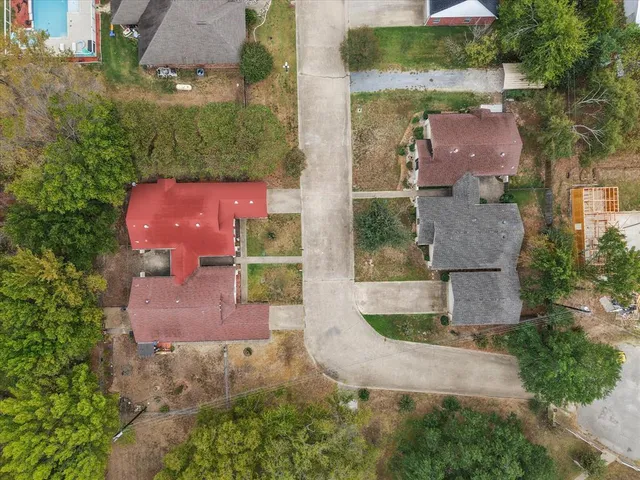an aerial view of residential houses with outdoor space