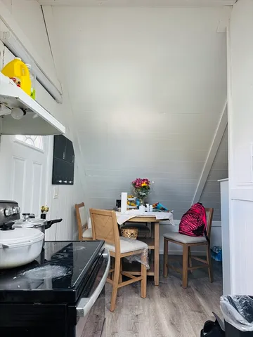 a kitchen with a table and chairs in it