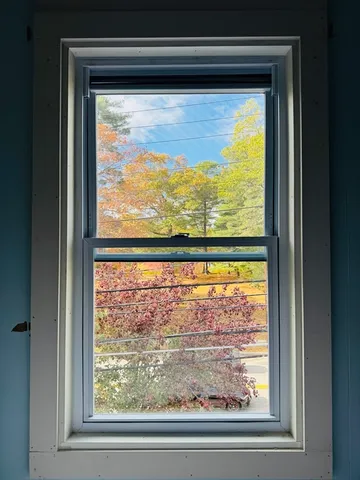 a view of a hallway with wooden shelves