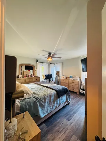 a bedroom with a bed and window