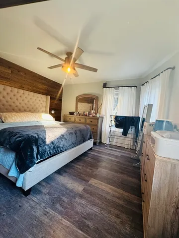 a bedroom with a bed and dresser