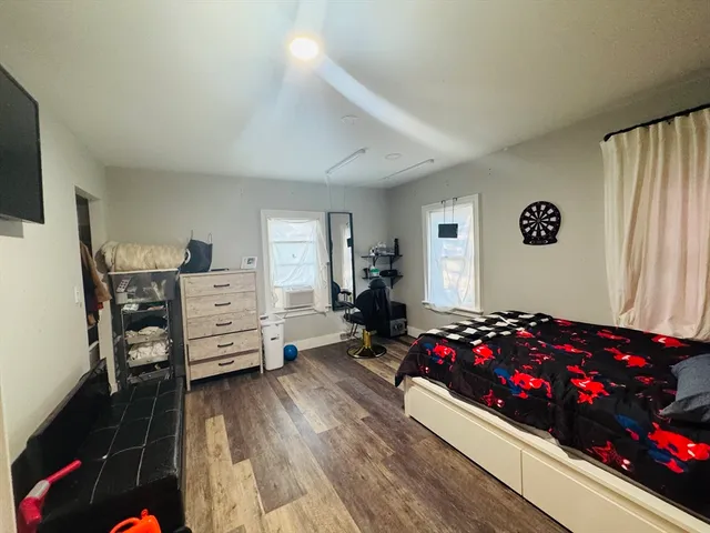 a bedroom with bed and a couch