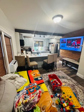 a kitchen with stainless steel appliances a stove sink microwave and cabinets