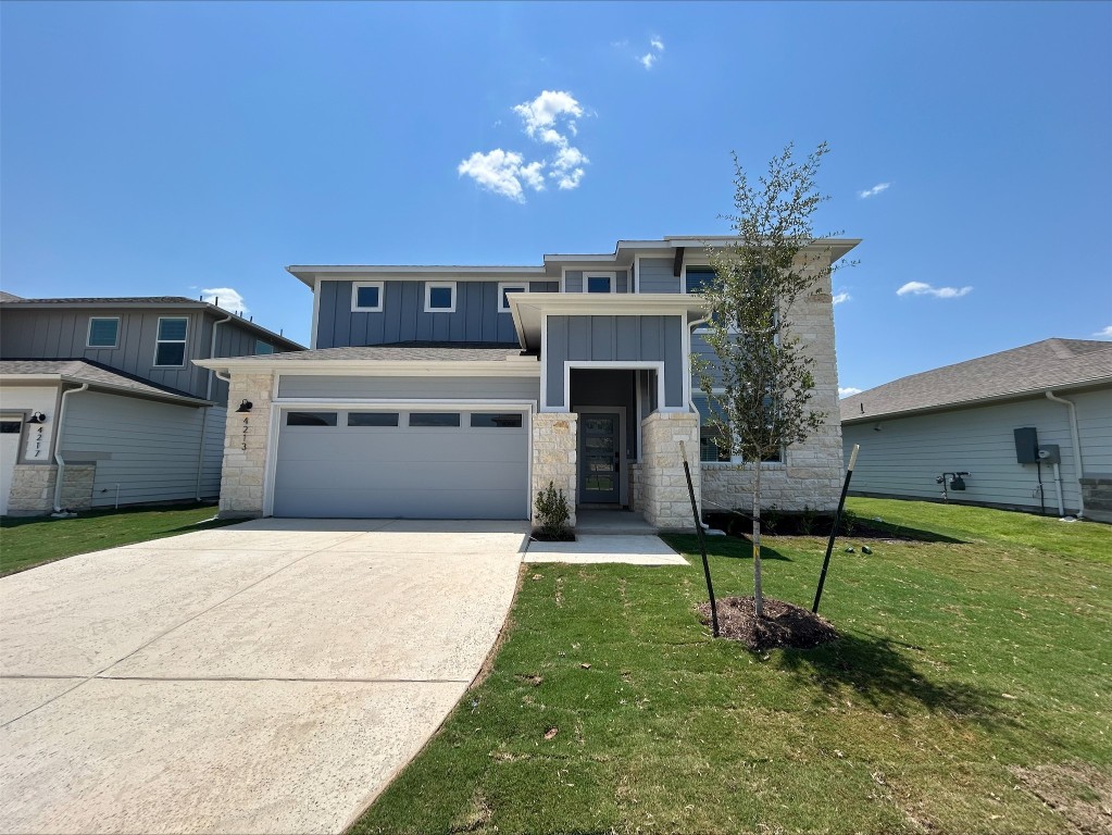4213 Forel Road Pflugerville, TX 78660 - Photo 2 of 10 a house view with a seating space and garden