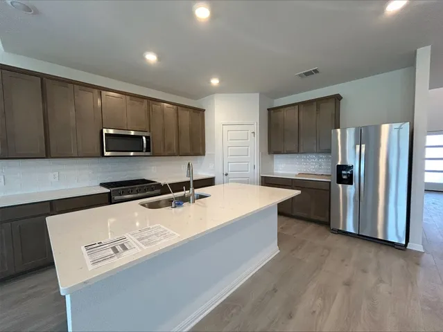 a bathroom with a double vanity sink mirror and double