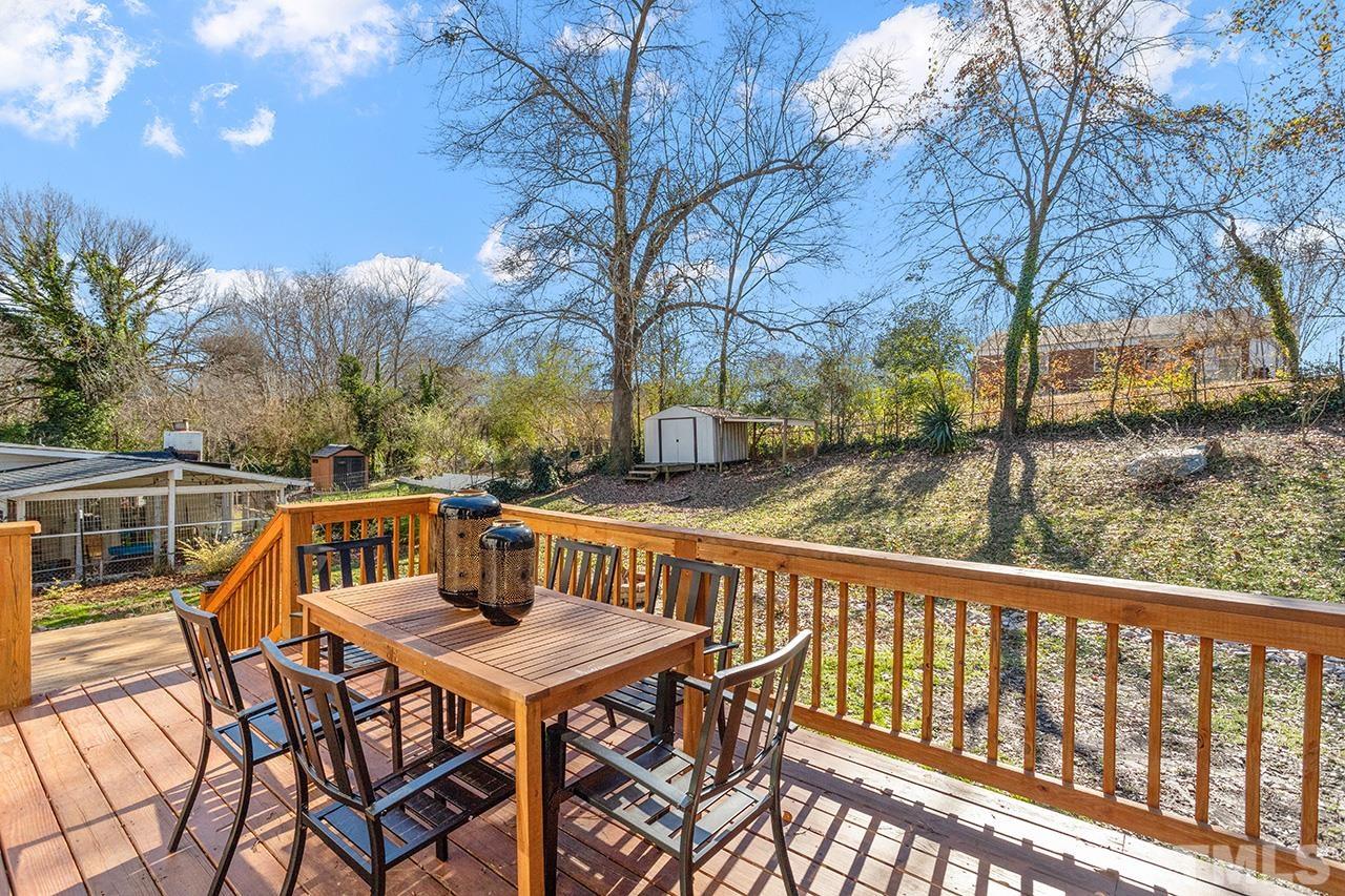 2404 Remington Road Raleigh, NC 27610 - Photo 8 of 33 a view of a chairs and table on the roof deck