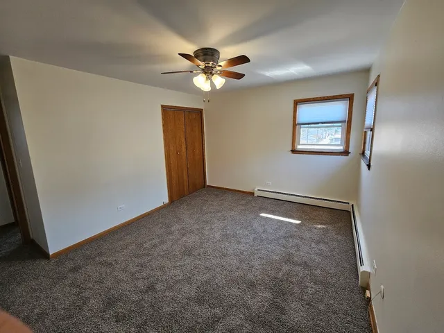 a view of room with window and ceiling fan