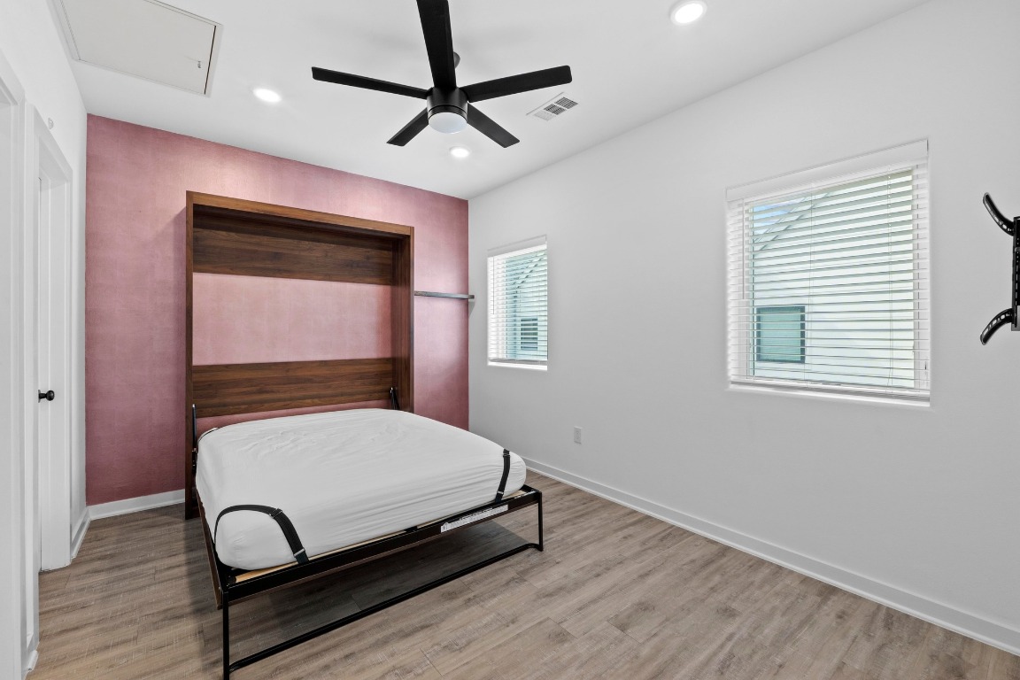 5924 South Congress Avenue, Unit 114S Austin, TX 78745 - Photo 14 of 24 a bedroom with a bed and window