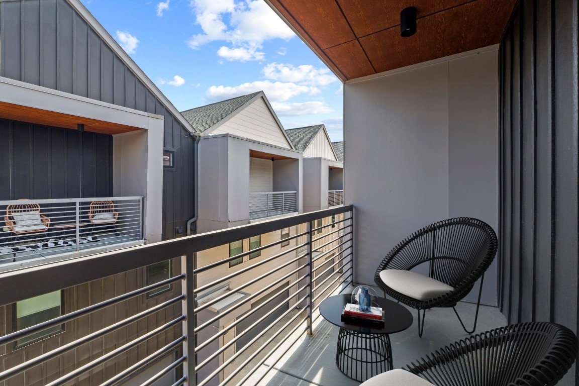 5924 South Congress Avenue, Unit 114S Austin, TX 78745 - Photo 15 of 24 a balcony with table and chairs