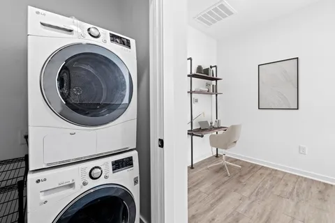 a view of a storage & utility room with wooden floor
