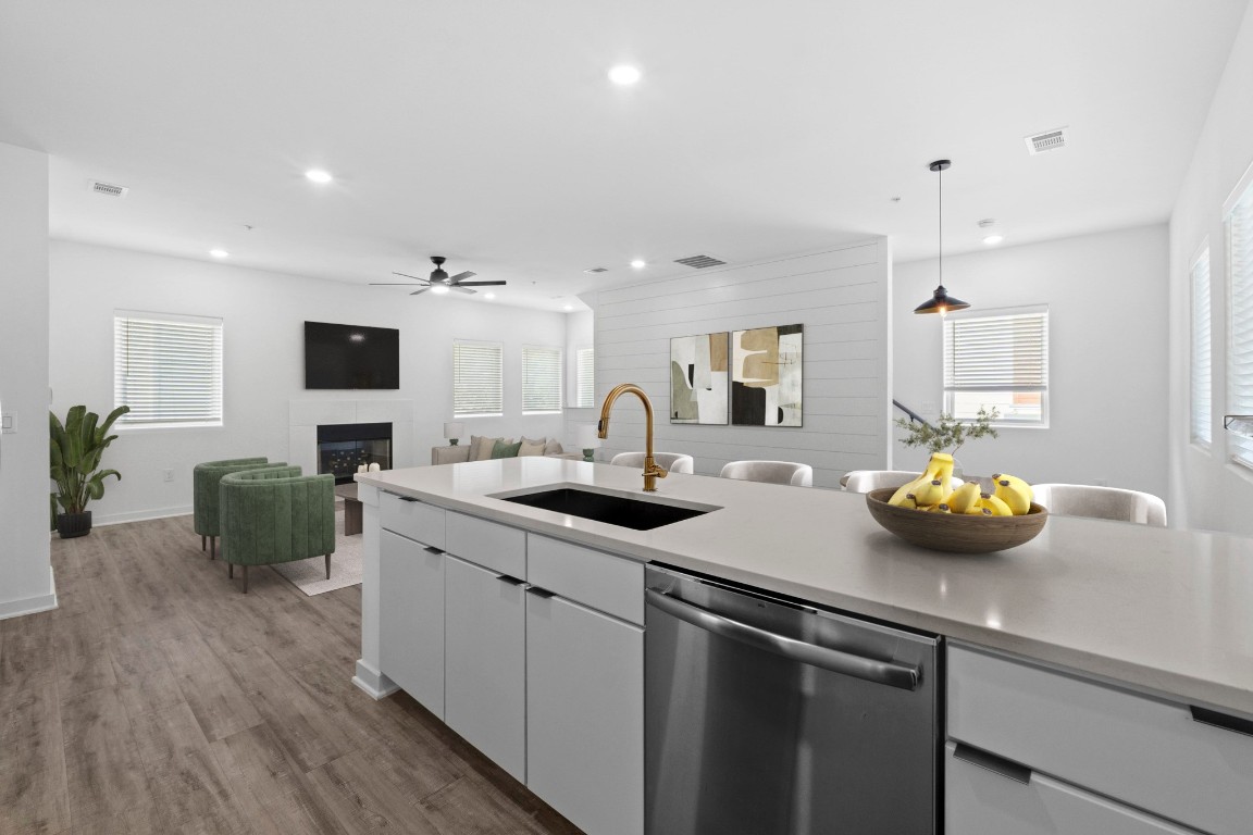 5924 South Congress Avenue, Unit 114S Austin, TX 78745 - Photo 2 of 24 a kitchen with a sink and a stove top oven
