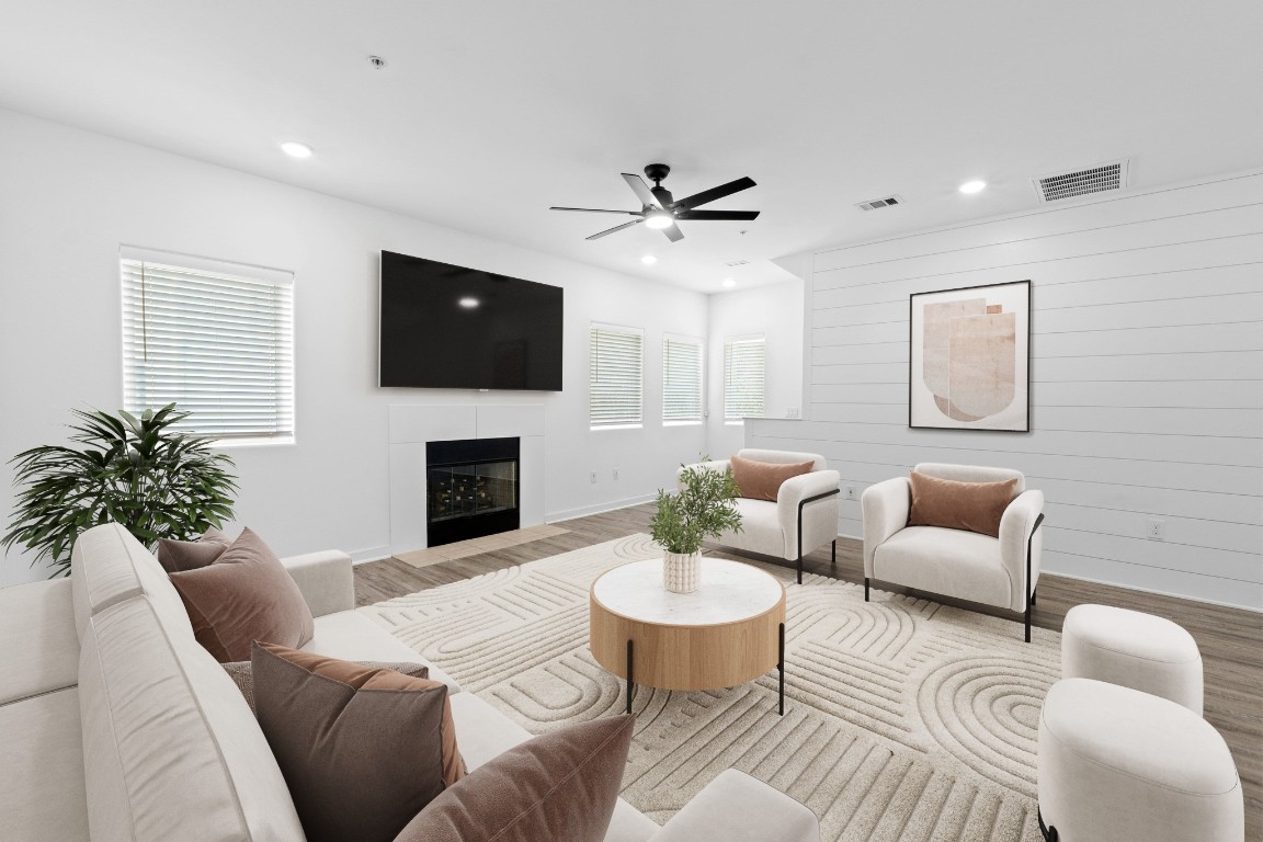 5924 South Congress Avenue, Unit 114S Austin, TX 78745 - Photo 4 of 24 a living room with furniture a flat screen tv and a ceiling fan
