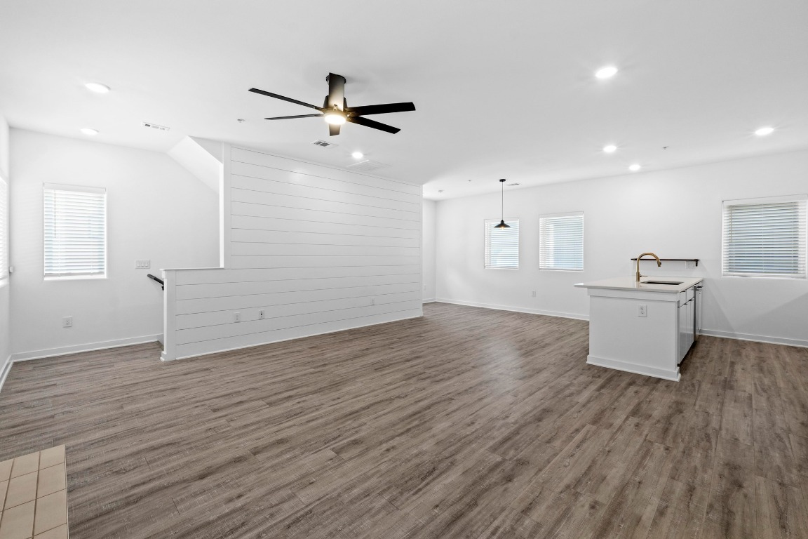 5924 South Congress Avenue, Unit 114S Austin, TX 78745 - Photo 6 of 24 a view of a kitchen with wooden floor and a sink