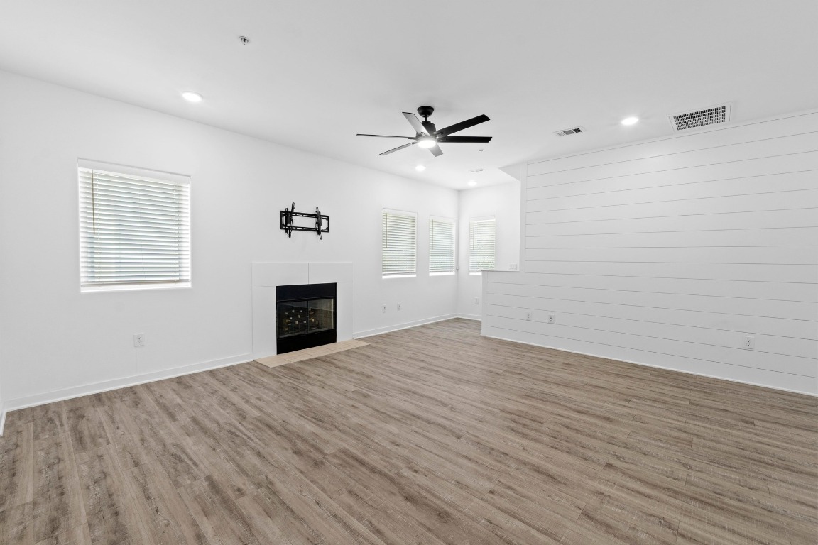 5924 South Congress Avenue, Unit 114S Austin, TX 78745 - Photo 7 of 24 wooden floor in an empty room with a window