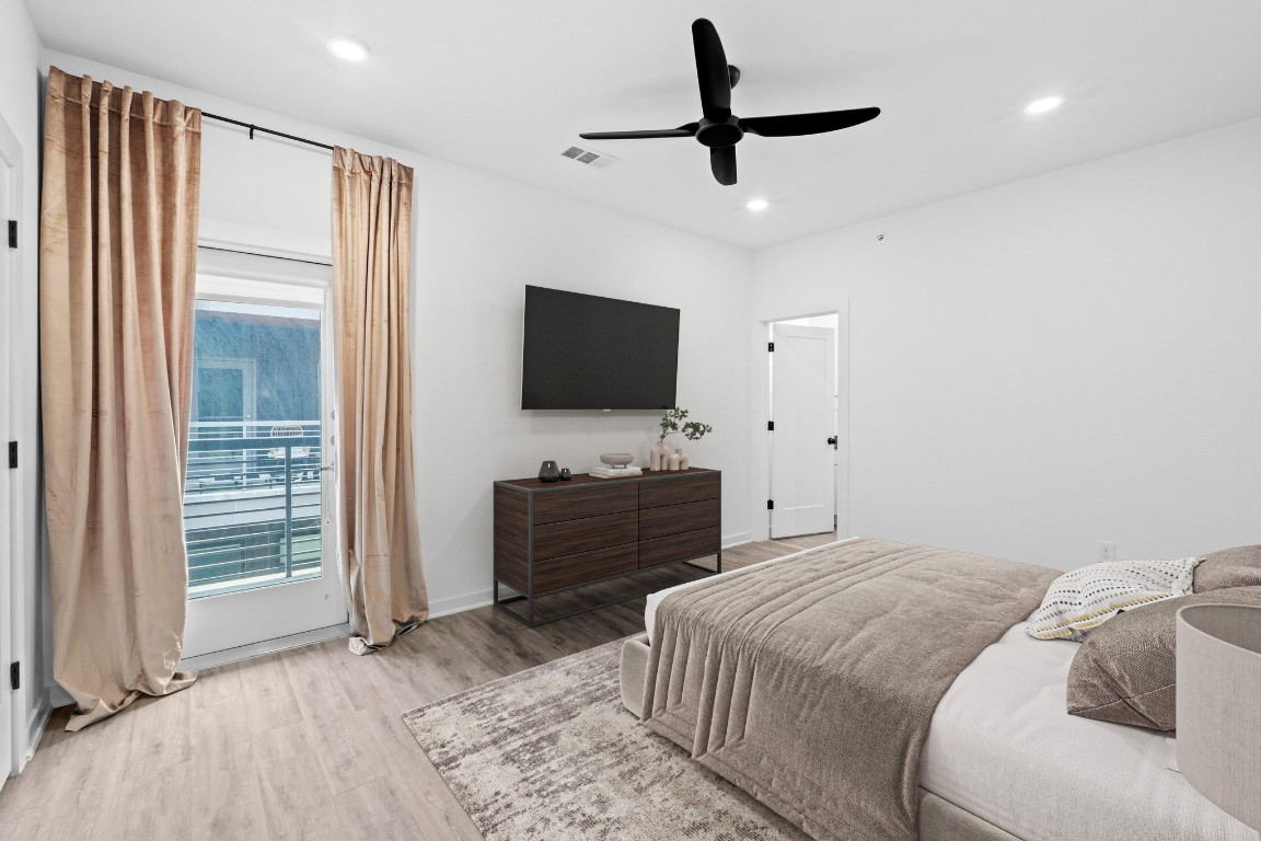 5924 South Congress Avenue, Unit 114S Austin, TX 78745 - Photo 9 of 24 a bedroom with a bed and a flat screen tv