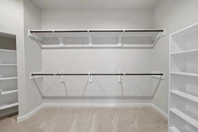 a view of an empty walk in closet