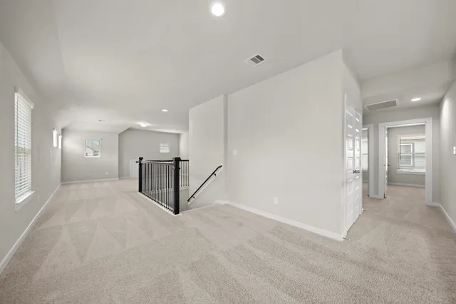 a view of a hall with kitchen