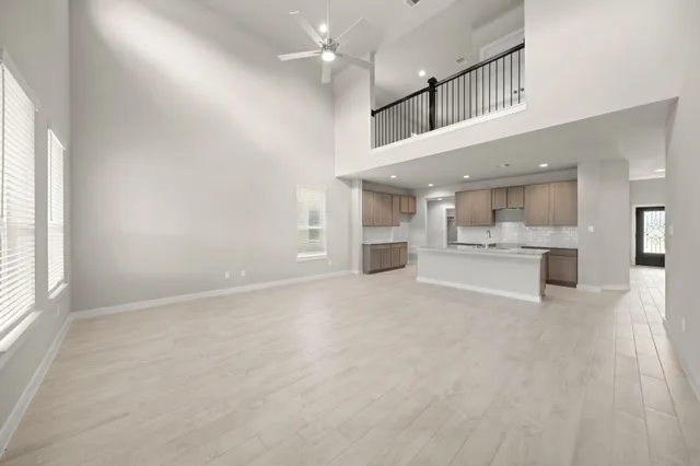 a view of kitchen with sink and window