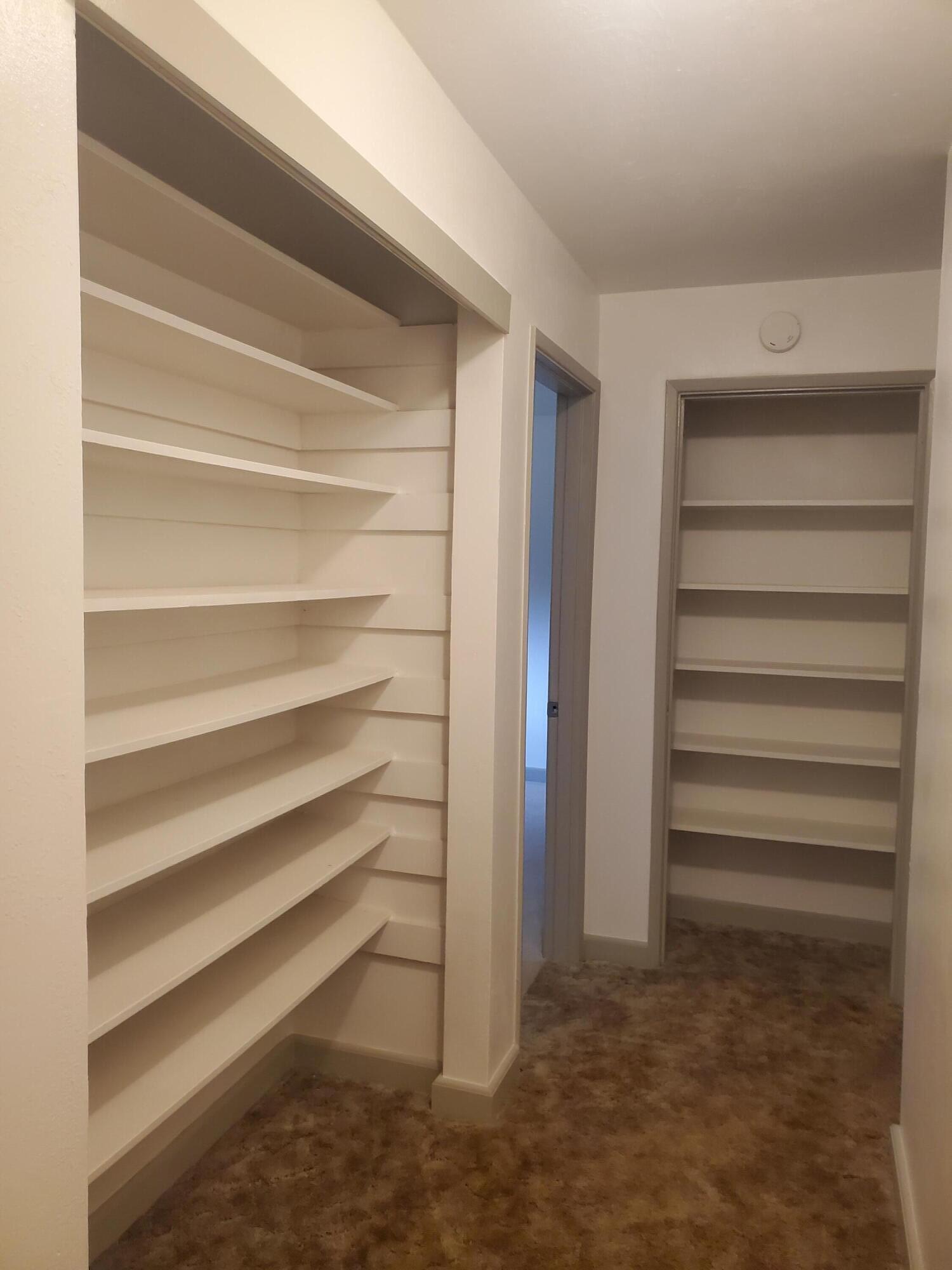 513 Queens Branch Road Rogue River, OR 97537 - Photo 14 of 56 a view of walk in closet with empty racks