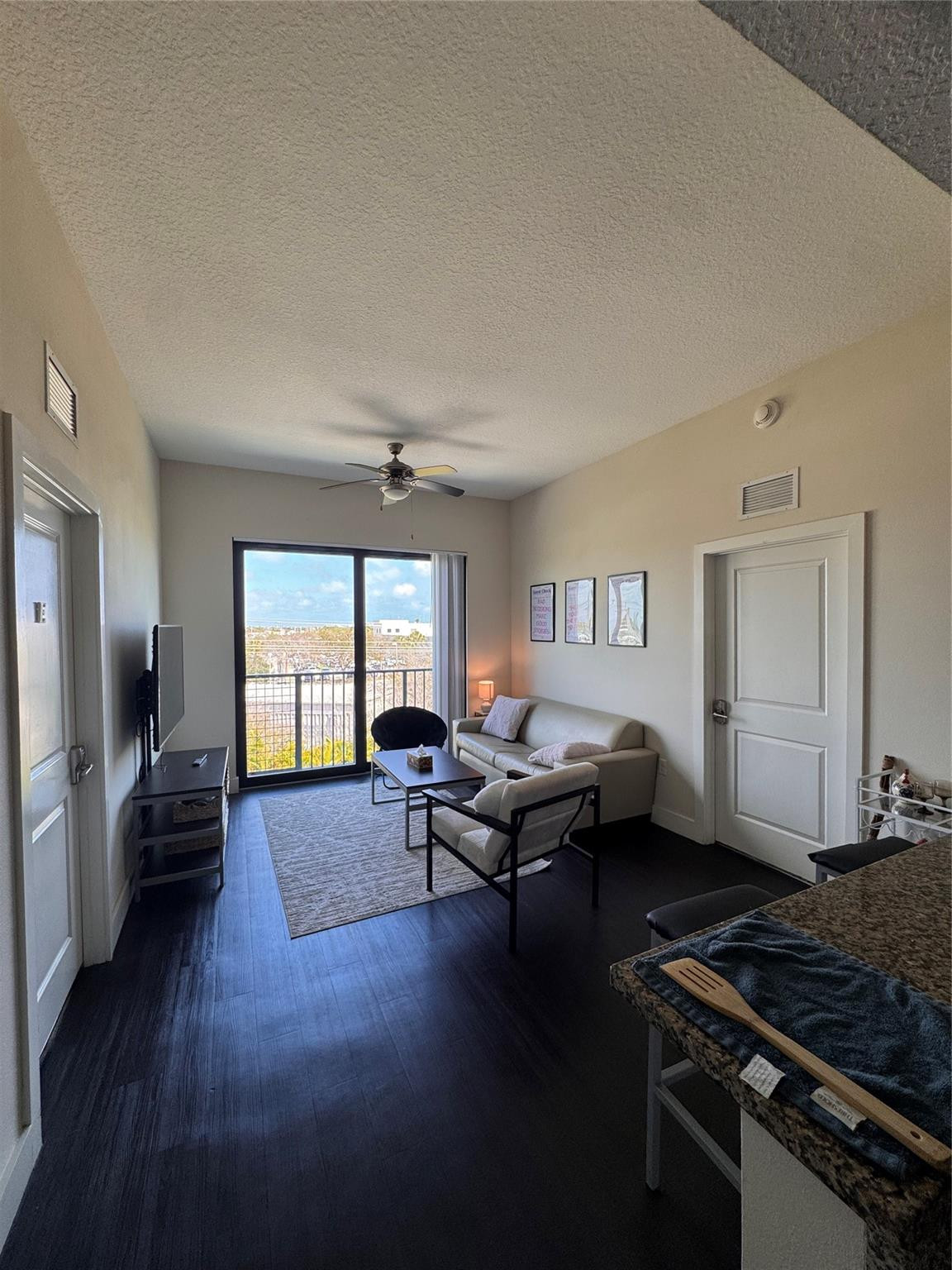 135 Northwest 20th Street, Unit E45B Boca Raton, FL 33431 - Photo 11 of 21 a living room with furniture and a window