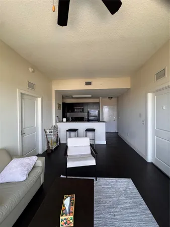 a living room with furniture and a rug