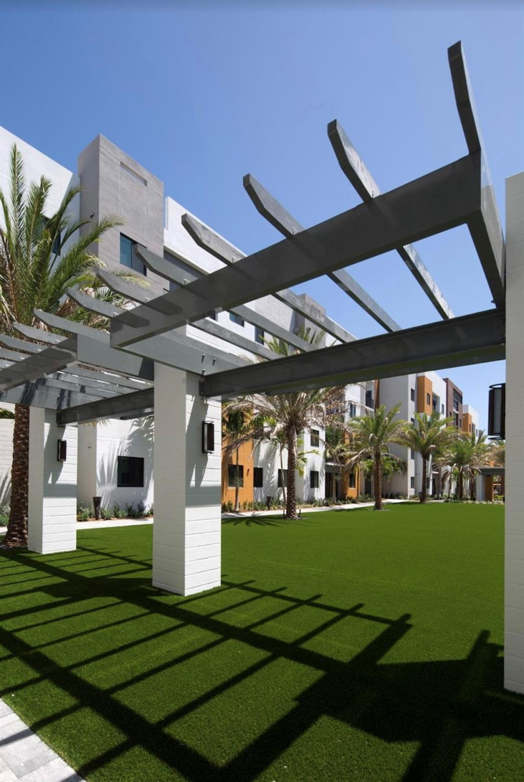 135 Northwest 20th Street, Unit E45B Boca Raton, FL 33431 - Photo 15 of 21 a view of a chairs and table in a yard