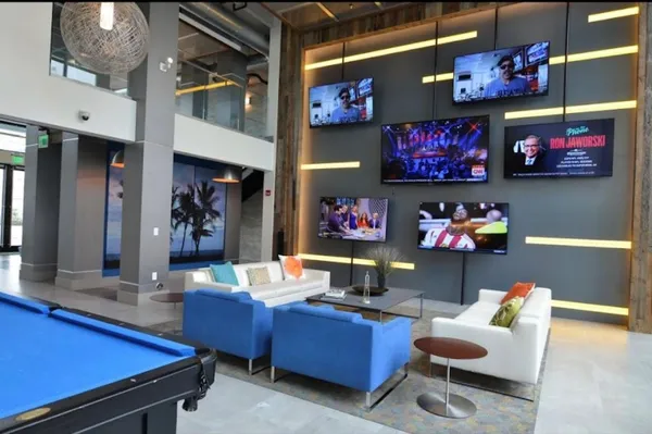 a outdoor living space with furniture and a flat screen tv