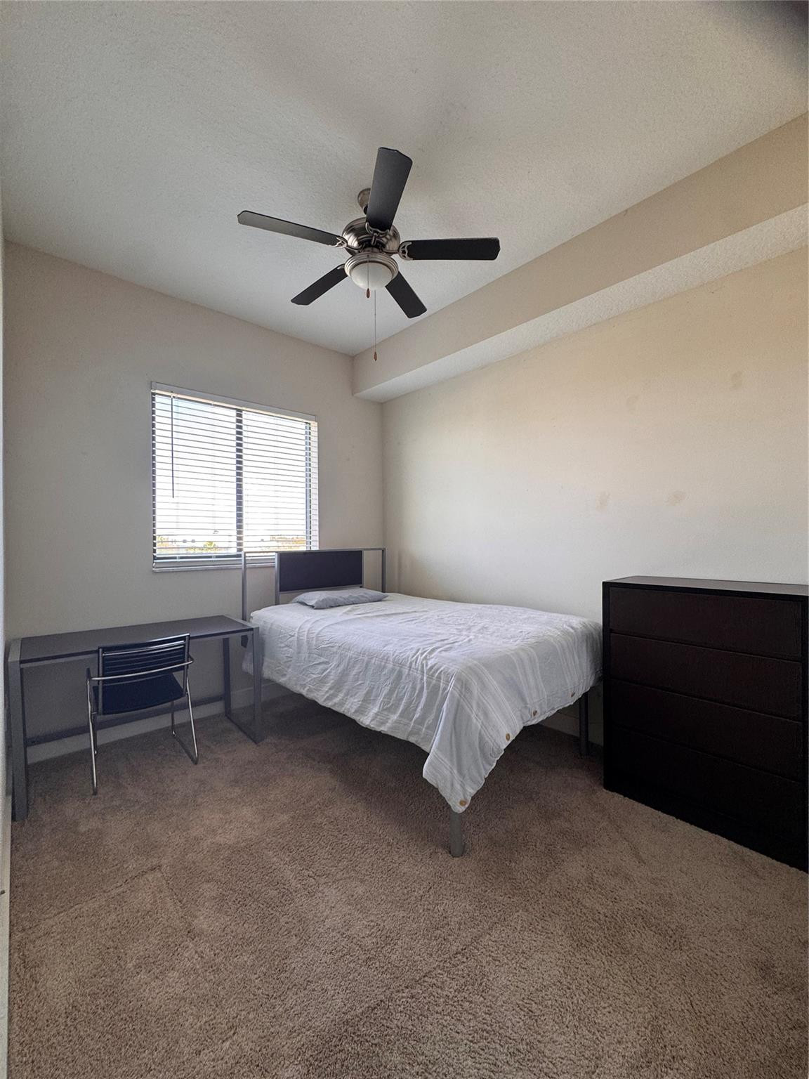 135 Northwest 20th Street, Unit E45B Boca Raton, FL 33431 - Photo 8 of 21 a spacious bedroom with a bed and a window