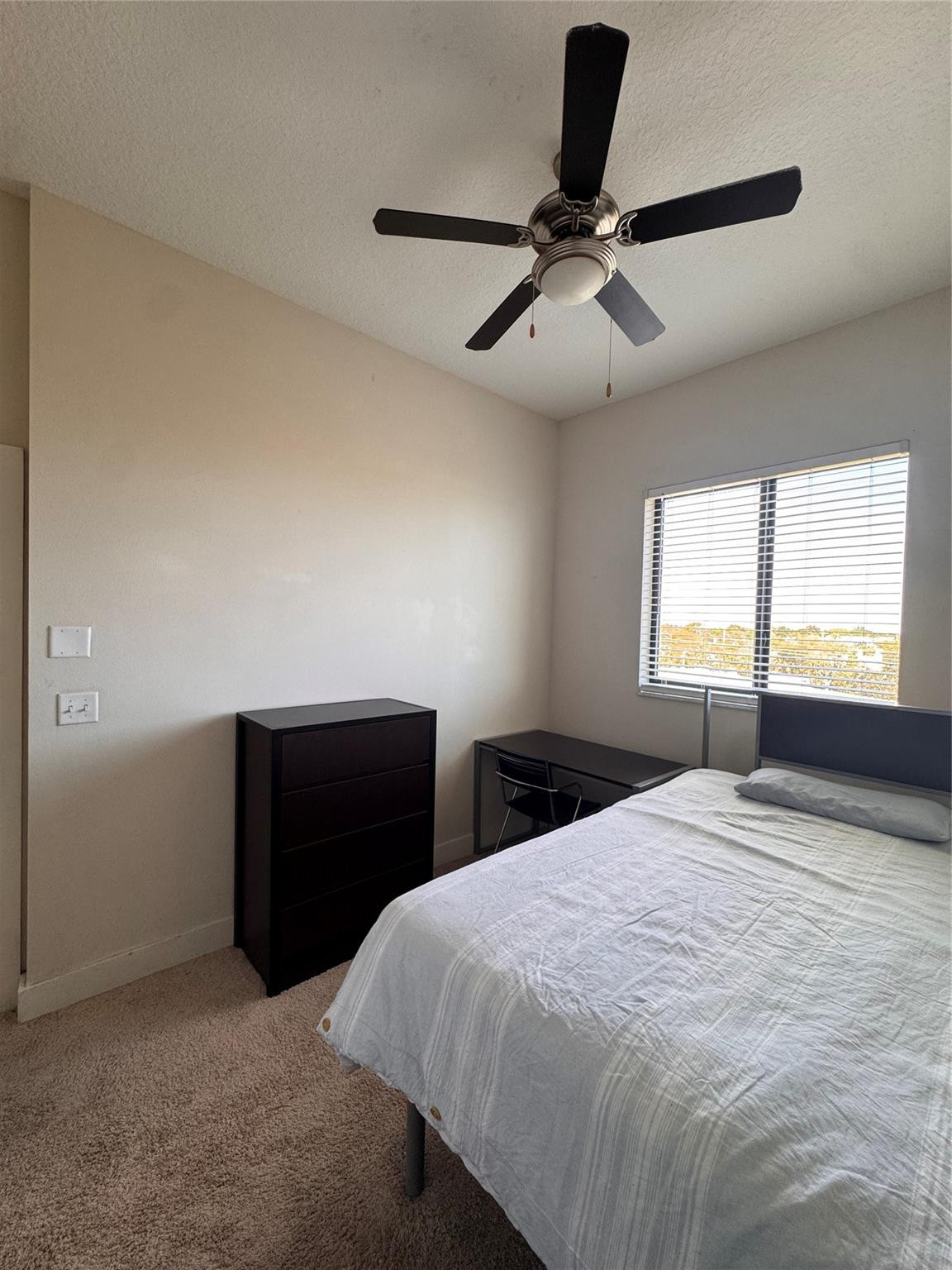 135 Northwest 20th Street, Unit E45B Boca Raton, FL 33431 - Photo 9 of 21 a bedroom with a bed and window