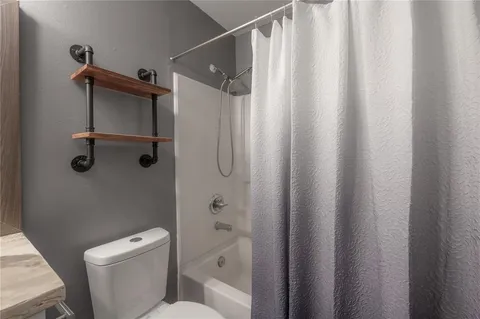 a bathroom with a shower curtain