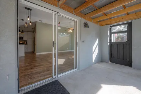 a view of gallery with wooden floor