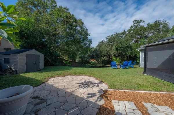 a view of house with backyard space and garden