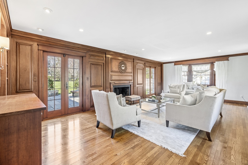 3 Goldthwait Road Marblehead, MA 01945 - Photo 16 of 30 a living room with furniture a fireplace and a floor to ceiling window