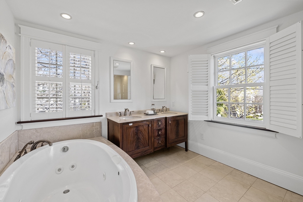 3 Goldthwait Road Marblehead, MA 01945 - Photo 20 of 30 a bathroom with a bathtub sink and mirror