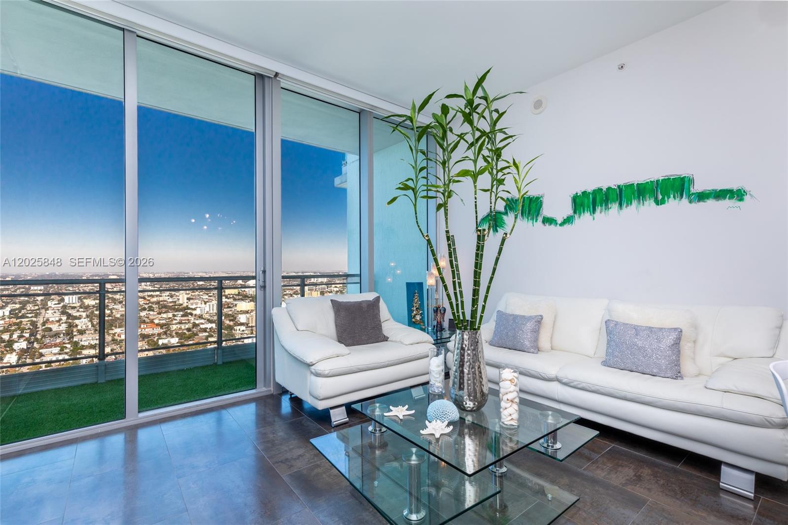 92 Southwest 3rd Street, Unit 5108 Miami, FL 33130 - Photo 3 of 33 a living room with furniture and a potted plant