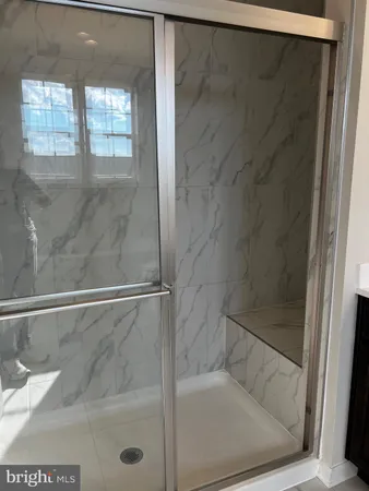 a bathroom with a sink double vanity and a mirror