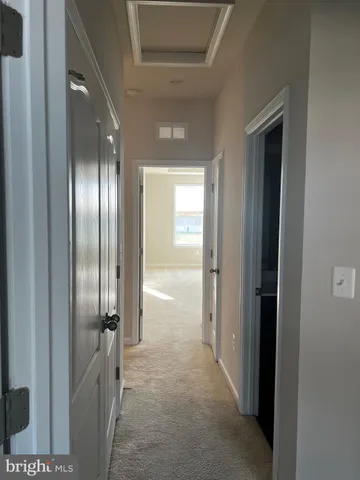 a view of a livingroom with furniture wooden floor and chandelier