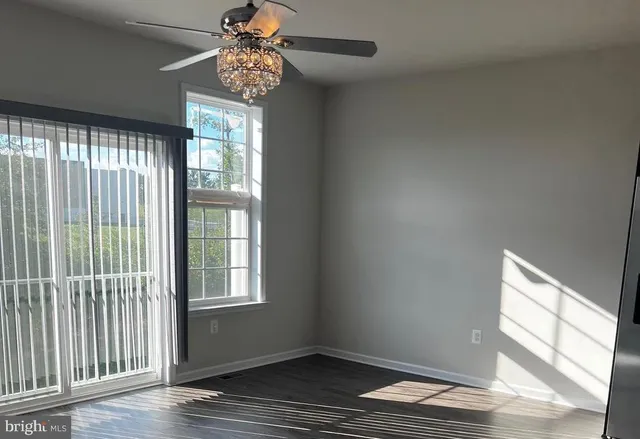 a kitchen with stainless steel appliances granite countertop a sink a stove a refrigerator and cabinets