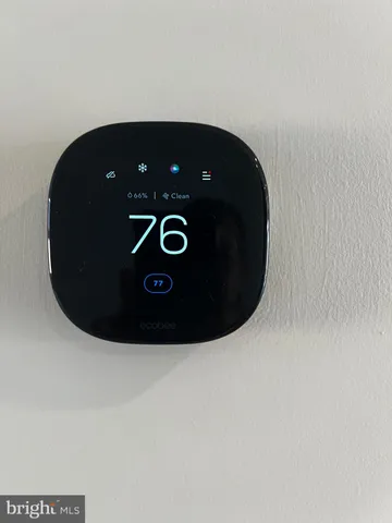 a view of a floor to ceiling window and wooden floor