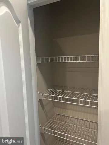 a bathroom with a toilet and a window