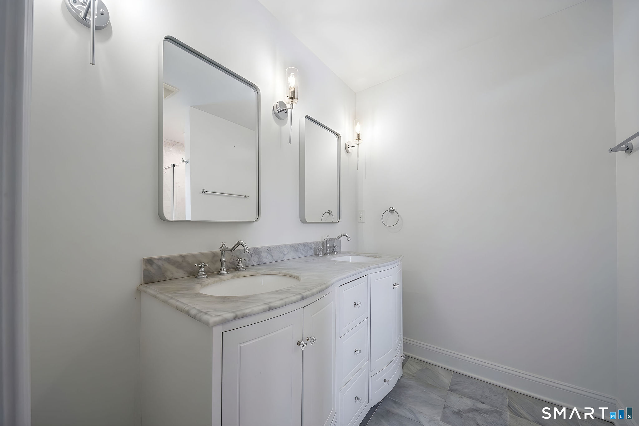 9 Sunset Ridge Drive Guilford, CT 06437 - Photo 21 of 40 a bathroom with a sink and a mirror