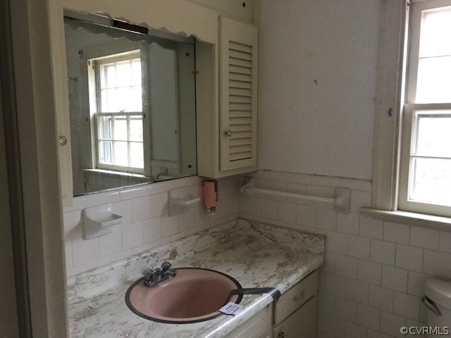 3629 Falstone Road North Chesterfield, VA 23234 - Photo 16 of 24 a bathroom with a granite countertop sink toilet and mirror