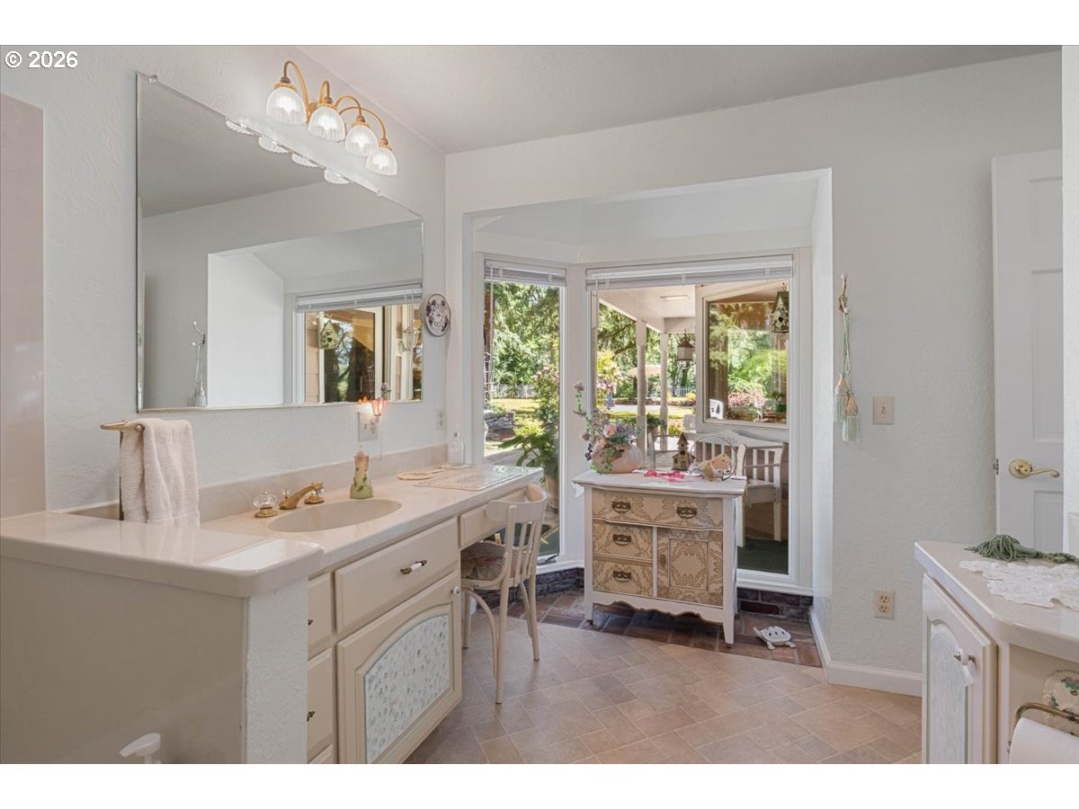 1300 Fair Oaks Road Oakland, OR 97462 - Photo 22 of 48 a bathroom with a sink mirror and a window