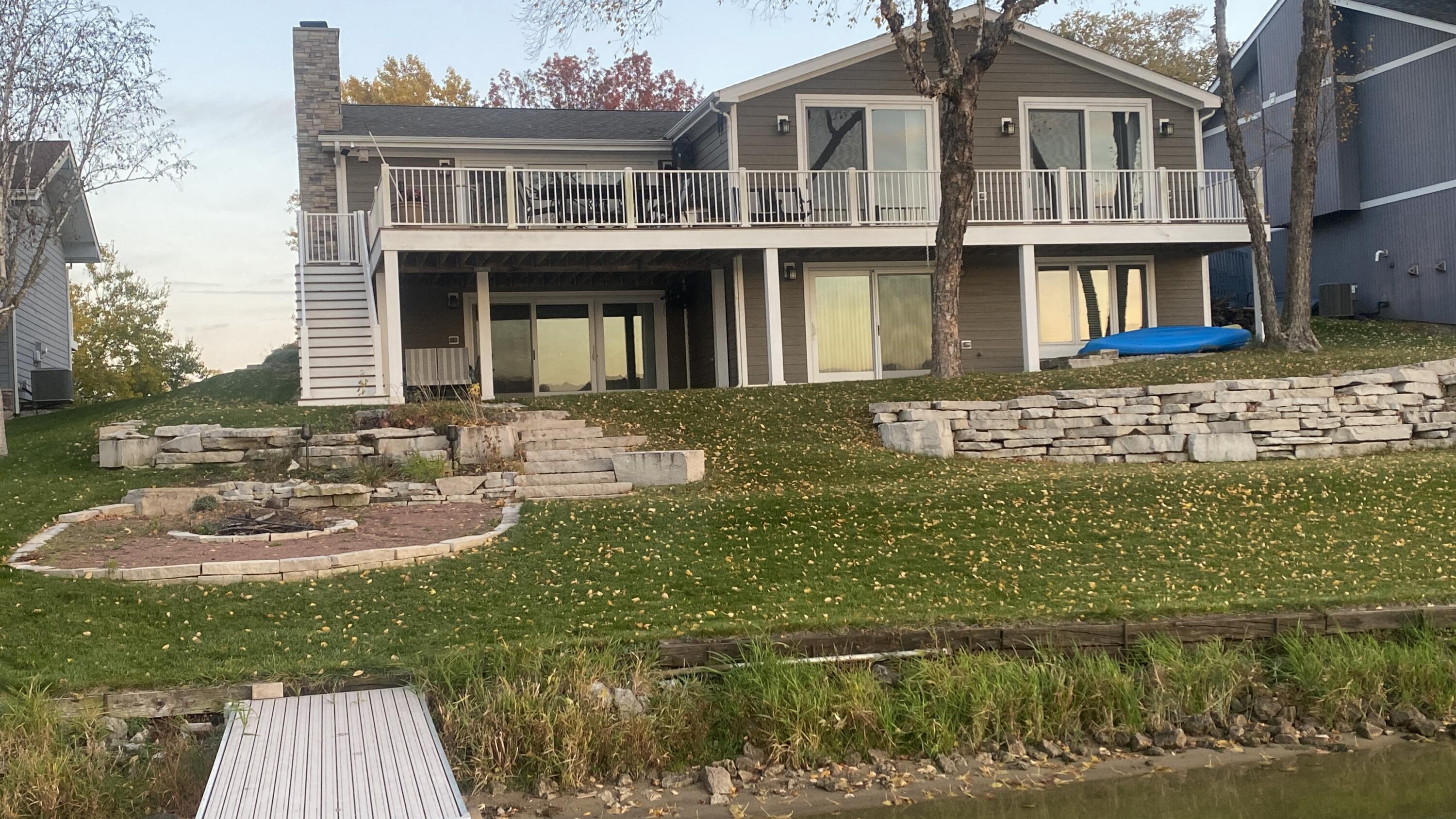 1728 Beachview Court Crown Point, IN 46307 - Photo 102 of 114 a front view of a house with a garden and lake view
