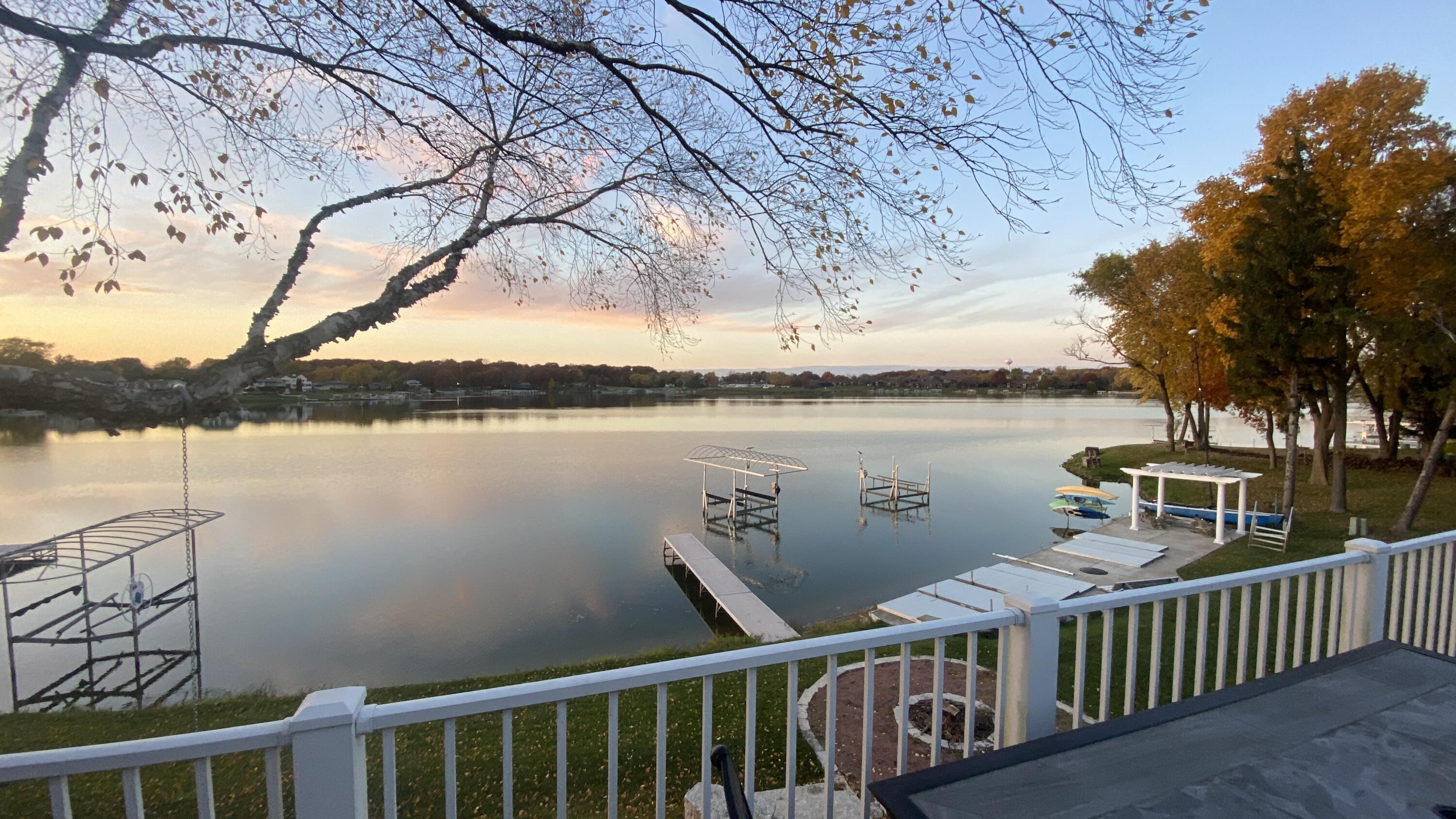 1728 Beachview Court Crown Point, IN 46307 - Photo 11 of 114 a view of a lake with trees in front of it