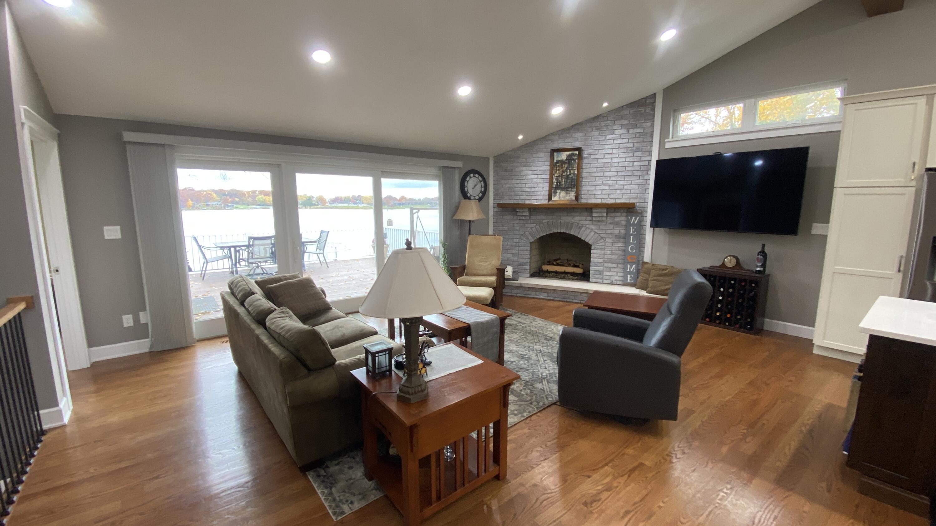 1728 Beachview Court Crown Point, IN 46307 - Photo 16 of 114 a living room with fireplace furniture and a flat screen tv