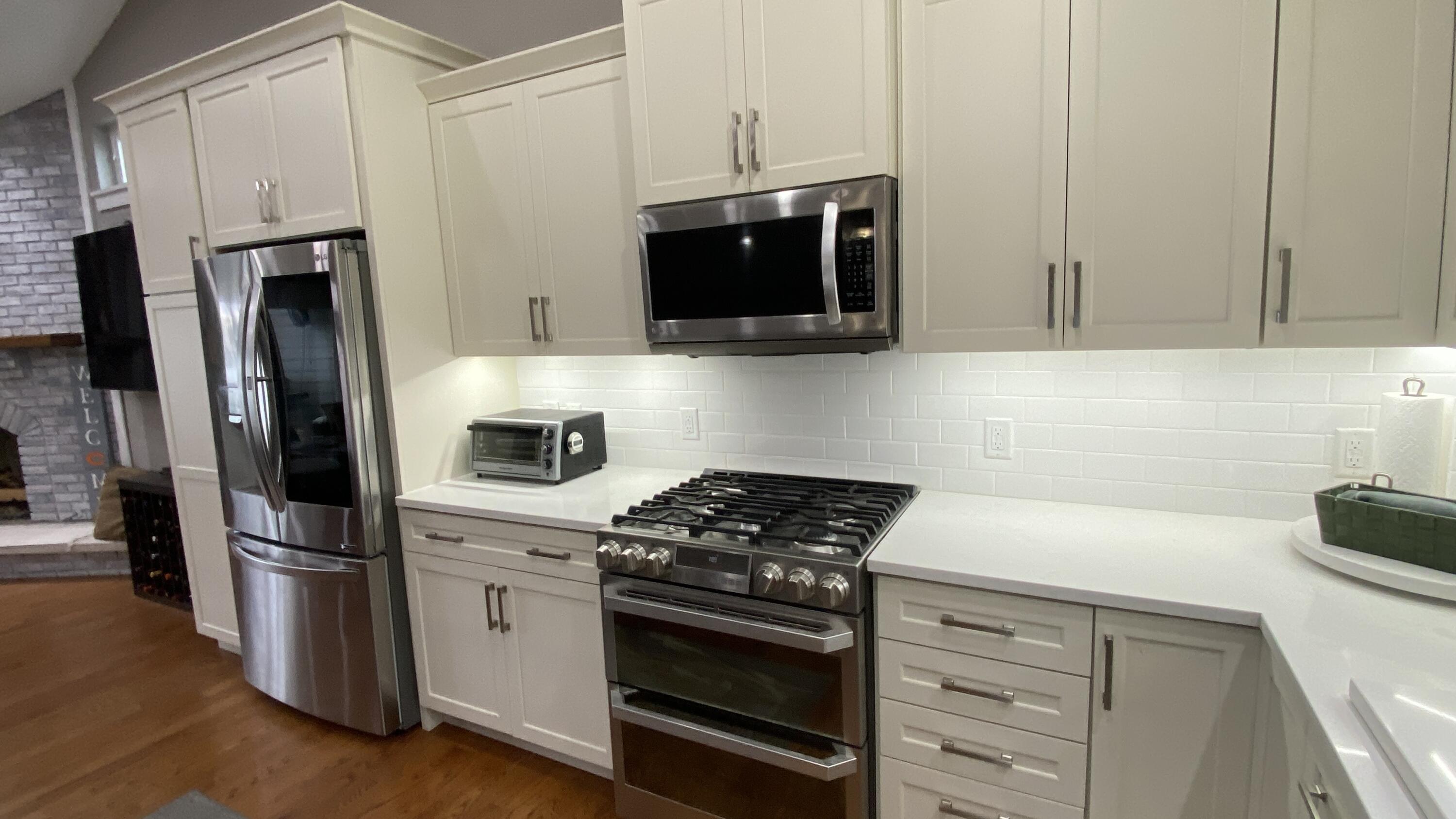 1728 Beachview Court Crown Point, IN 46307 - Photo 22 of 114 a kitchen with stainless steel appliances a stove a microwave and refrigerator