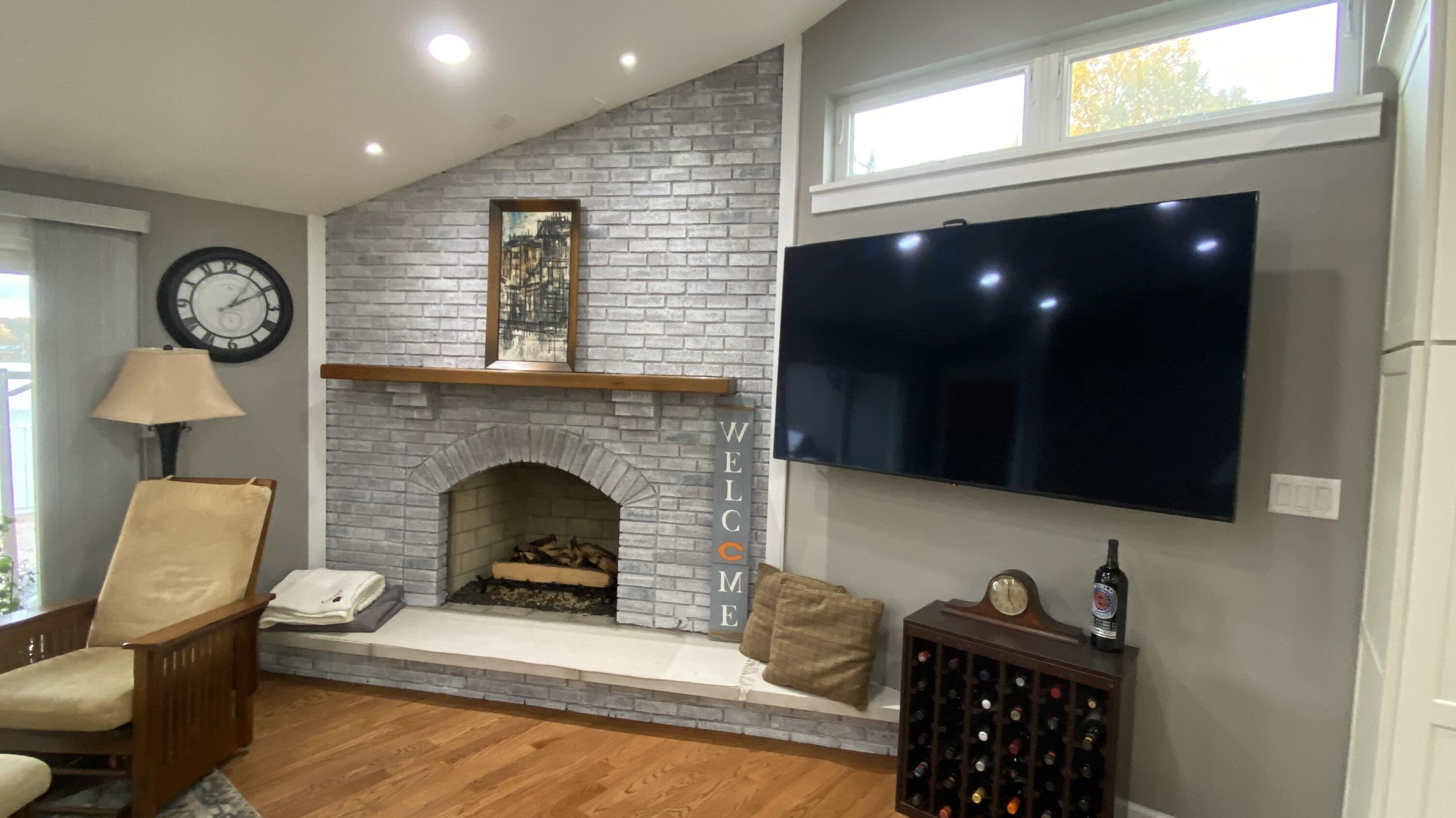 1728 Beachview Court Crown Point, IN 46307 - Photo 23 of 114 a living room with furniture and a fireplace