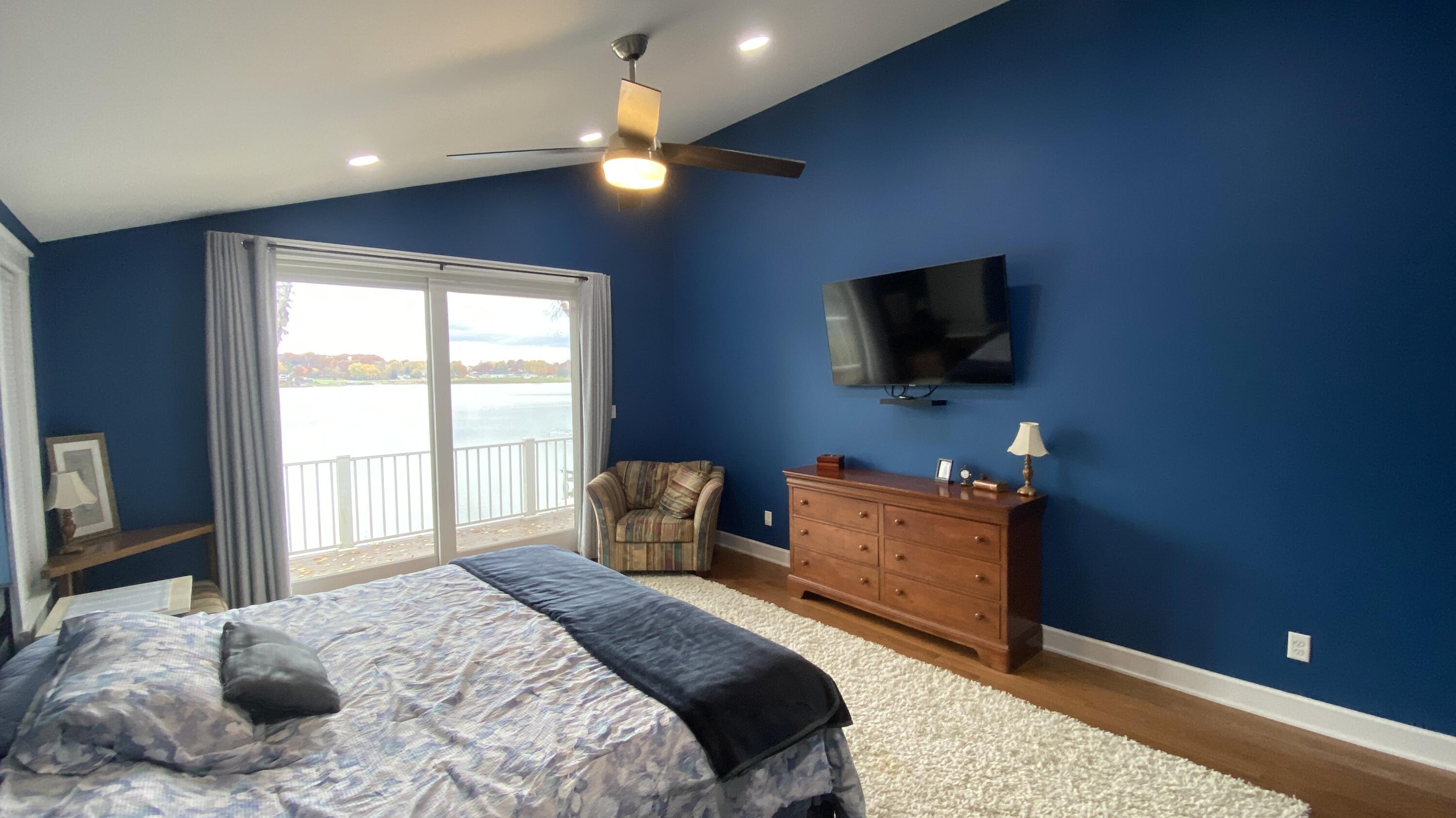 1728 Beachview Court Crown Point, IN 46307 - Photo 35 of 114 a bedroom with a bed and a flat screen tv
