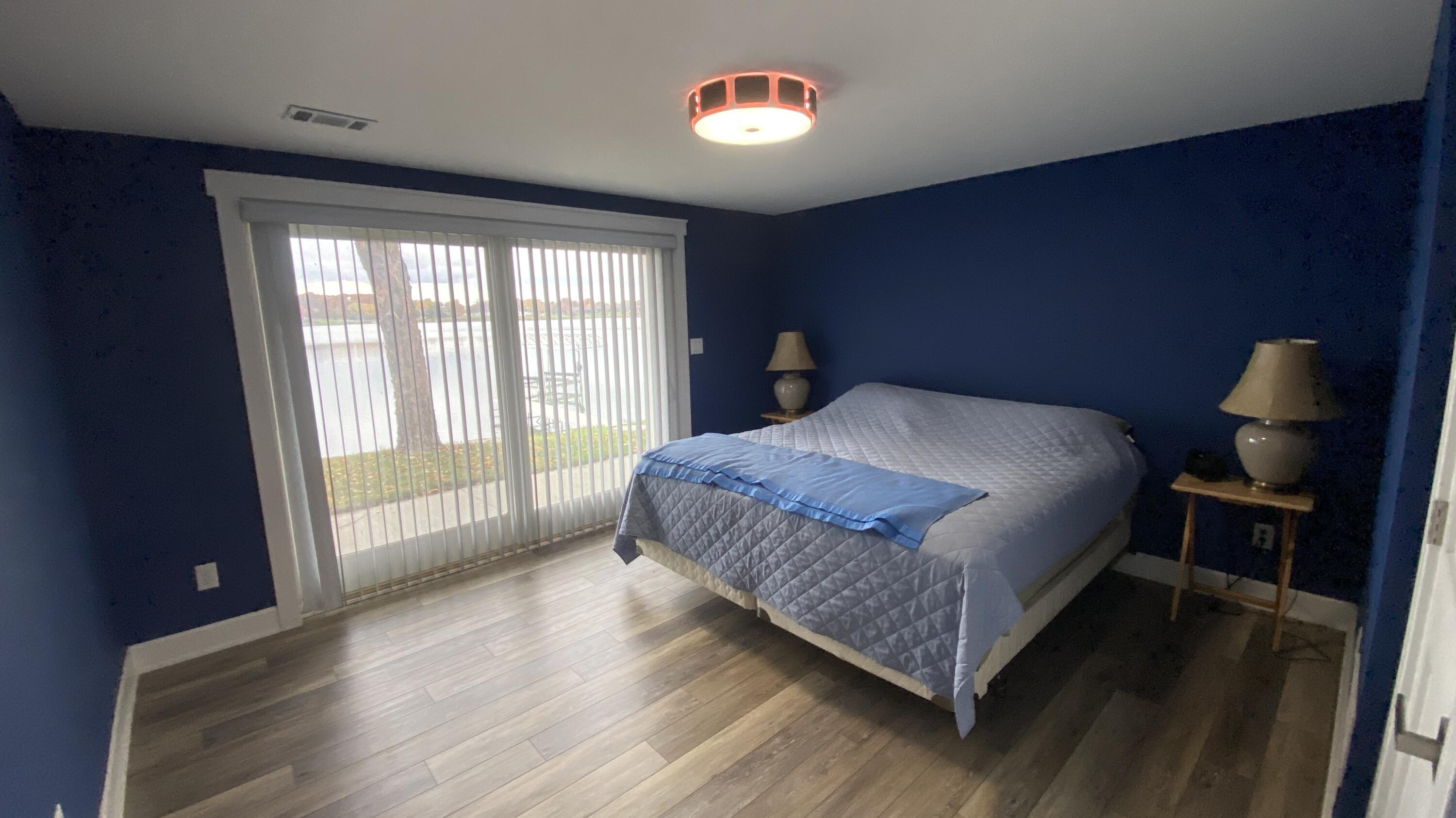 1728 Beachview Court Crown Point, IN 46307 - Photo 55 of 114 a bedroom with a bed and wooden floor